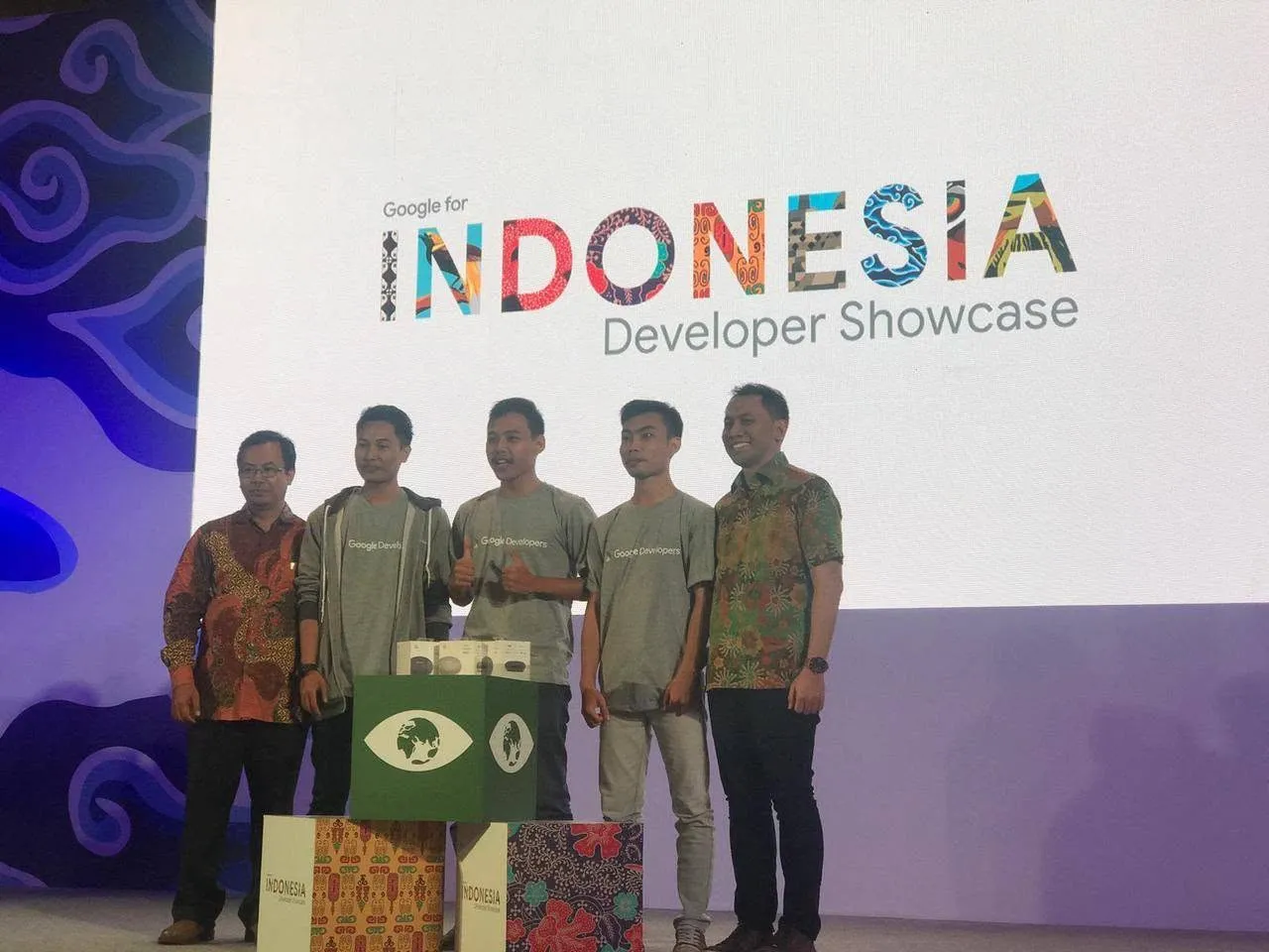 The Tanggap Bencana team on stage in front of the Google for Indonesia Developer Showcase screen